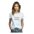 A woman wearing a white graphic t-shirt with 'The Chicken Bar 5-Star Dive Bar' printed on the chest, posed against a solid blue background.